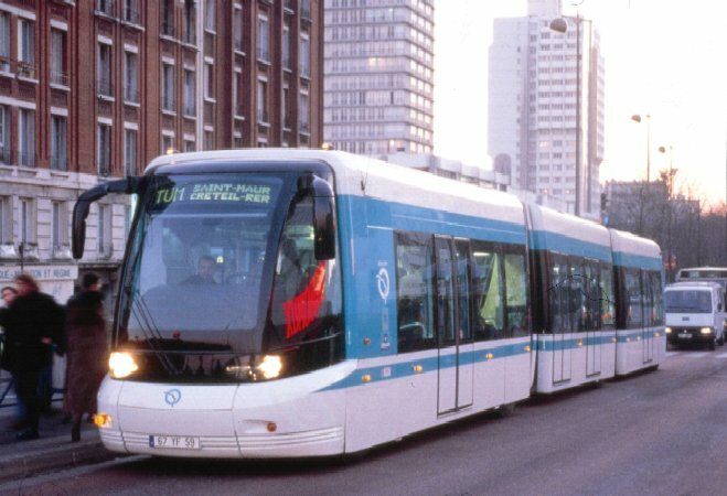 Guided Street Tram in front of urban building